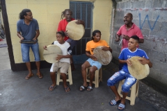 Members of Lespri Ravann playing the instruments: (left to right) the maravann, the ravann and the triyang