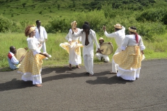 Female and Male dancers dancing to the beat of the instruments and manoeuvre among themselves
